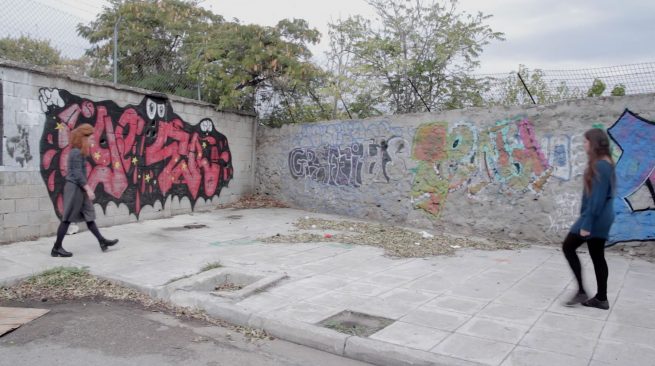 This is a still from the video installation Absence. It depicts two performers that are on the way to meet