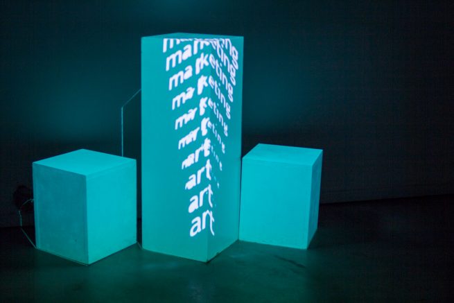 from the work art market. A work that I did with Demosthene Agraphiotis. The photo depicts a projection mapping on 3 boxes. Inside the boxes there was music playing inviting the visitors to go closer.