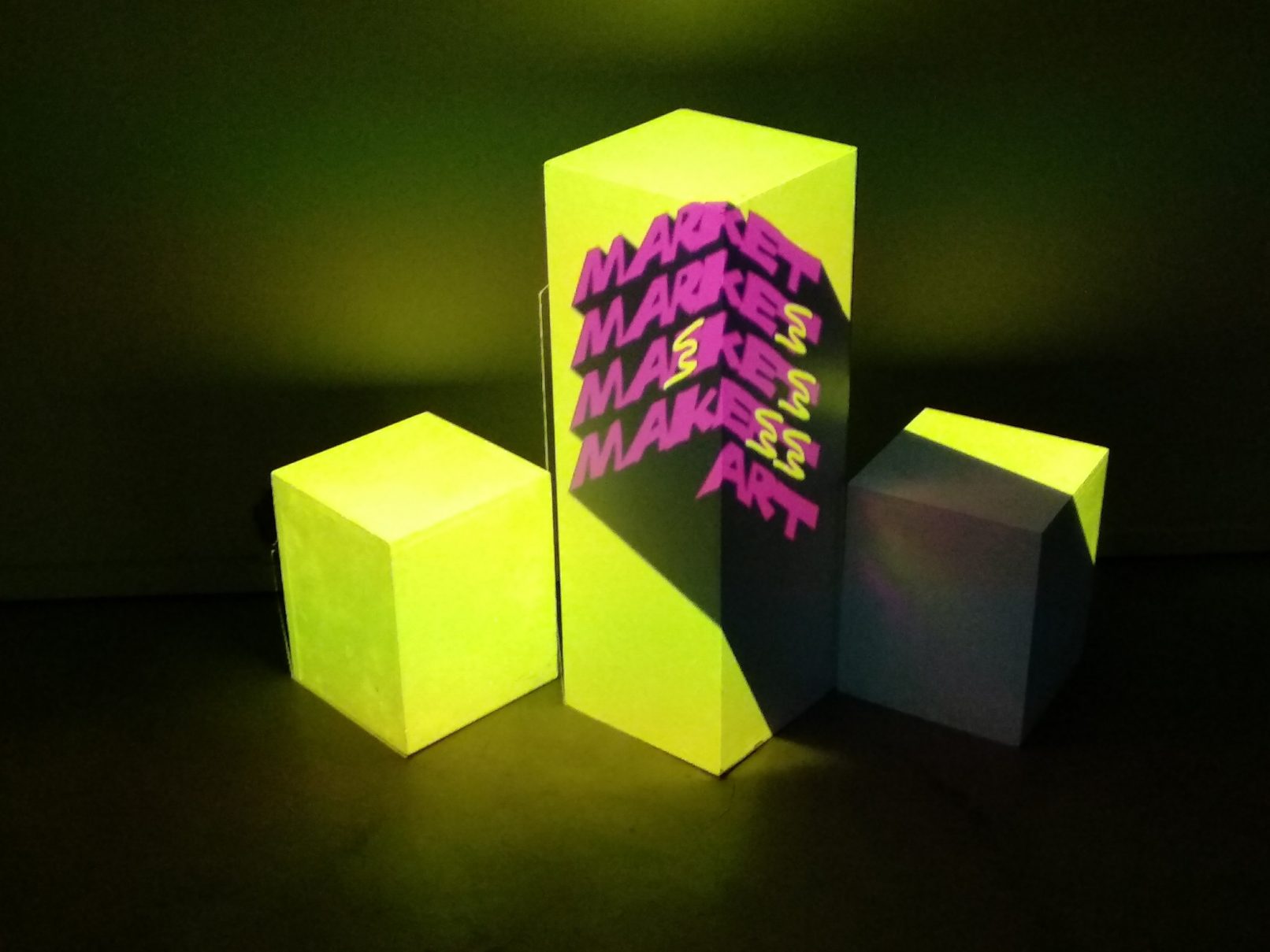 from the work art market. A work that I did with Demosthene Agraphiotis. The photo depicts a projection mapping on 3 boxes. Inside the boxes there was music playing inviting the visitors to go closer.