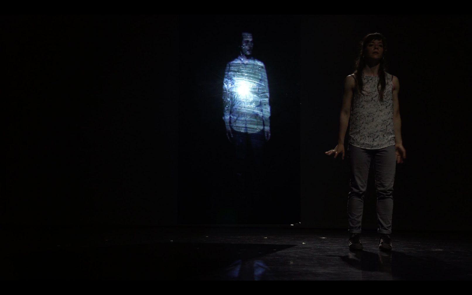 the performer Myrto delimihali with the projection of Stathis Doganis