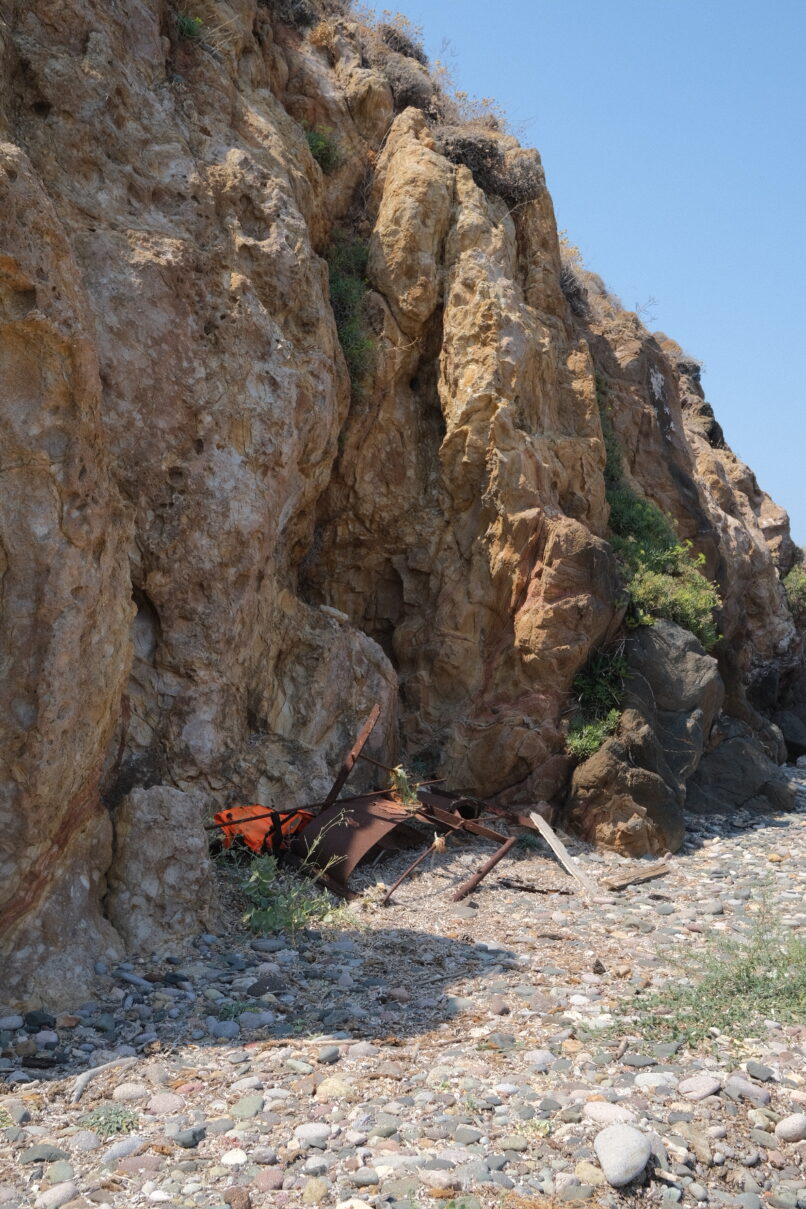 View of the Eftalou beach were there are evidences of refugee lifejackets
