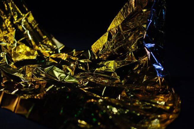 Golden safety blanket on dark background